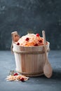 Sauerkraut with carrots and cranberries in wooden bucket Royalty Free Stock Photo