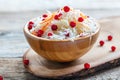 Sauerkraut with cowberry in a wooden bowl.