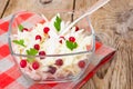 Sauerkraut with cranberries in a glass bowl on a wooden backgro Royalty Free Stock Photo