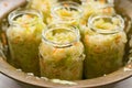 Sauerkraut fermentation in copper bowl, glass pot. Cut white cabbage fermented by lactic acid bacteria Royalty Free Stock Photo