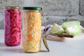 Sauerkraut in glass jar, marinated cabbage, carrot and beetroot. Probiotic and fermented food. Pickles. Canned vegetarian food con Royalty Free Stock Photo