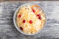 Sauerkraut, marinated cabbage on a gray wooden background. Top view, close up