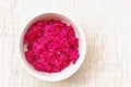 Sauerkraut and red beet in the bawl on the white background