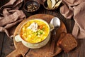 Sauerkraut soup in ceramic bowl on wooden table Royalty Free Stock Photo