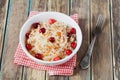 Sauerkraut or sour cabbage with cranberries in a white bowl on rustic wooden table Royalty Free Stock Photo