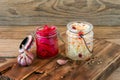 Sauerkraut variety preserving jars. Homemade Sauerkraut with Carrot and Salad Cabbage with Beetroot on a wooden table. Fermented