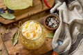 Sauerkraut variety preserving jars. Homemade Sauerkraut with Carrot on a wooden table.