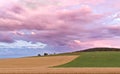 Sauerland, Germany - Rear view of a disappearing thunderstorm at sunset with dramatic blue and pink cloudscape over wooded hills Royalty Free Stock Photo