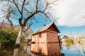 Sauna bath building In Water During Spring Flood floodwaters during natural disaster. Water deluge During A Spring Flood Royalty Free Stock Photo