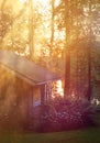 Sauna cottage in midsummer night near lake