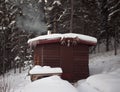 Sauna hut in winter forest Royalty Free Stock Photo