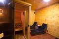 Sauna interior with two sunbeds and cherry wood walls Royalty Free Stock Photo