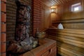 Sauna steam bath inside with stones and stove Royalty Free Stock Photo