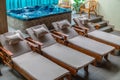 Sauna sun lounger made of wood and beige Jacuzzi room Royalty Free Stock Photo