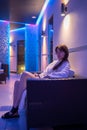 Young dark-haired woman spending time in sauna Royalty Free Stock Photo