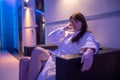 Young dark-haired woman spending time in sauna Royalty Free Stock Photo