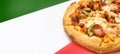 Sausage bacon Cheese pizza on green red color as italy Royalty Free Stock Photo