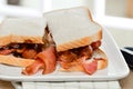 Sausage and bacon sandwich Royalty Free Stock Photo