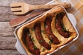 Sausage baked in pastry in a dish close up. Horizontal top view Royalty Free Stock Photo