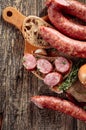 Sausage with bread and spices on a old wooden table Royalty Free Stock Photo