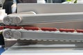 Sausage chain during produced by past on conveyor system of automatic machine for manufacturing process in food industry