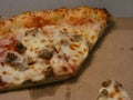 sausage and cheese pizza on cardboard delivery box Royalty Free Stock Photo