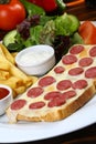 Sausage with cheese on slice of bread Royalty Free Stock Photo