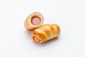 Sausage in the dough and half of the sausage in the dough Royalty Free Stock Photo
