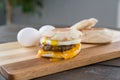 Sausage, Egg and Cheese Breakfast Sandwich with Yoke Royalty Free Stock Photo