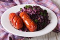 Sausage grill with stewed red cabbage close-up. horizontal Royalty Free Stock Photo