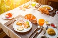 Sausage ham tomato omelets fried egg in a white dish on the table for breakfast Royalty Free Stock Photo