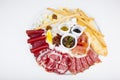 Sausage and jamon snacks with olives, honey and sauce Royalty Free Stock Photo