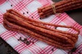 Sausage or kabanos and pepper on vintage wooden boards Royalty Free Stock Photo