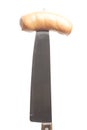 Sausage on a kitchen knife isolated on white background Royalty Free Stock Photo
