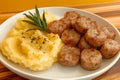 Sausage and mashed potatoes on white plate, background open for text or simple food quote Royalty Free Stock Photo
