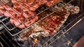 Meat on the grill. Using charcoal to barbecue. Detail of home food being cooked