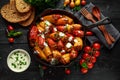 Sausage meat, mince and rice Stuffed sweet mini bell peppers baked in cast iron skillet, pan topped with yogurt and Royalty Free Stock Photo