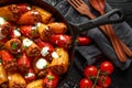 Sausage meat, mince and rice Stuffed sweet mini bell peppers baked in cast iron skillet, pan topped with yogurt and Royalty Free Stock Photo