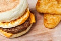 Sausage muffin with hash brown Royalty Free Stock Photo