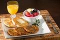Sausage Patty Breakfast with English Muffin, Fresh Fruit and Juice Royalty Free Stock Photo