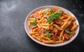 Sausage penne Pasta with tomato sauce and fresh herbs Royalty Free Stock Photo