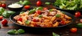 Sausage penne Pasta with tomato sauce, parmesan cheese and basil on black plate Royalty Free Stock Photo