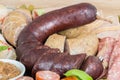 Sausage plate variation on a wooden table Royalty Free Stock Photo