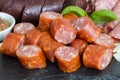 Sausage plate variation on a wooden table Royalty Free Stock Photo
