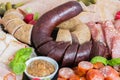 Sausage plate variation on a wooden table Royalty Free Stock Photo