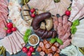 Sausage plate variation on a wooden table Royalty Free Stock Photo