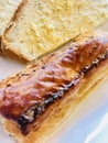 Sausage roll with bread and butter Royalty Free Stock Photo
