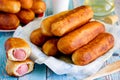 Sausage rolls, pastry wrapped sausages, sausage pies in dough Royalty Free Stock Photo