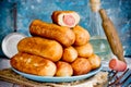 Sausage rolls, pastry wrapped sausages, fried meat sausages in blankets, sausage pies in dough Royalty Free Stock Photo