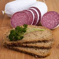 Sausage - salami, bread, parsley Royalty Free Stock Photo
